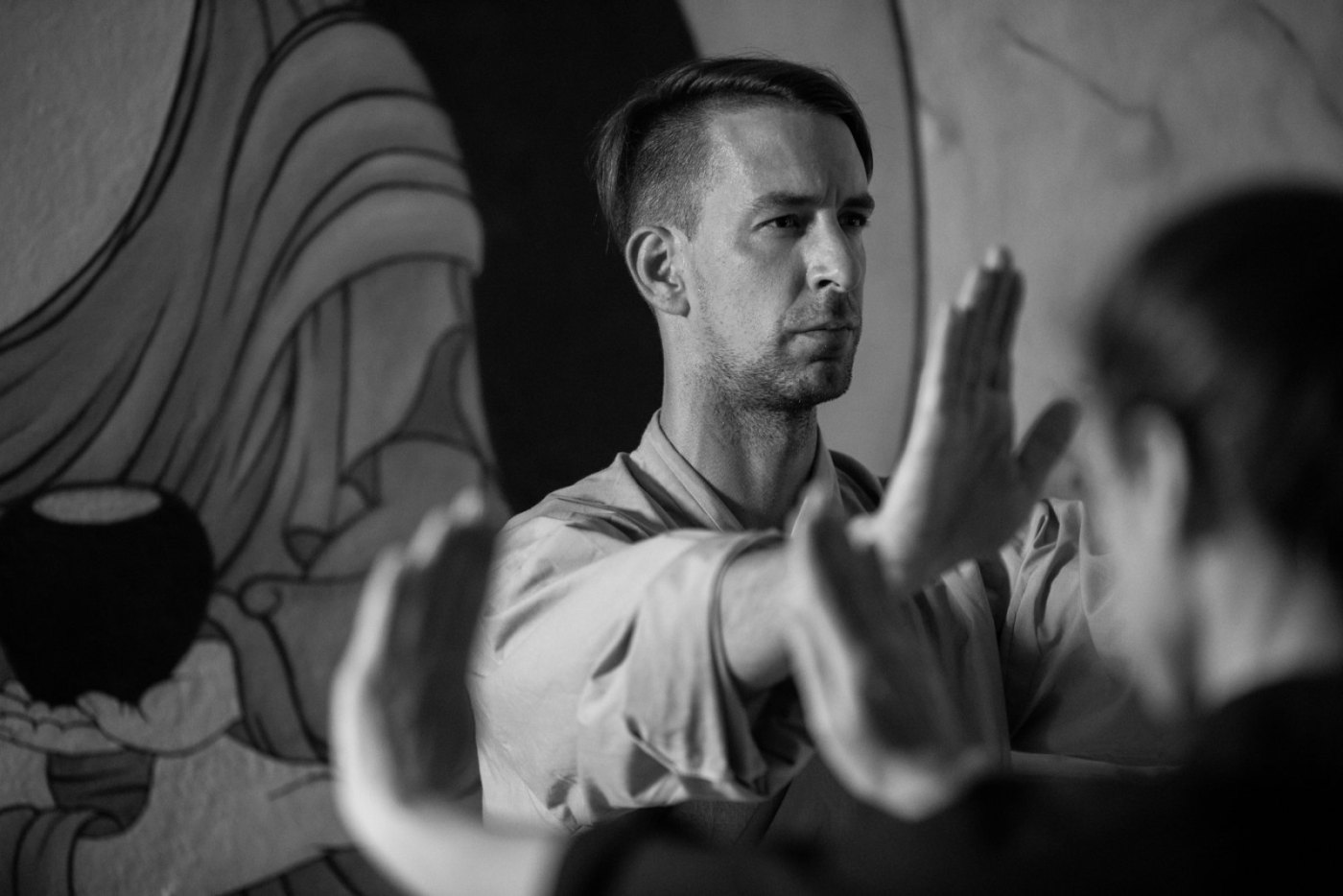 A teacher mid-technique in the Body.Mind Ljubljana training hall